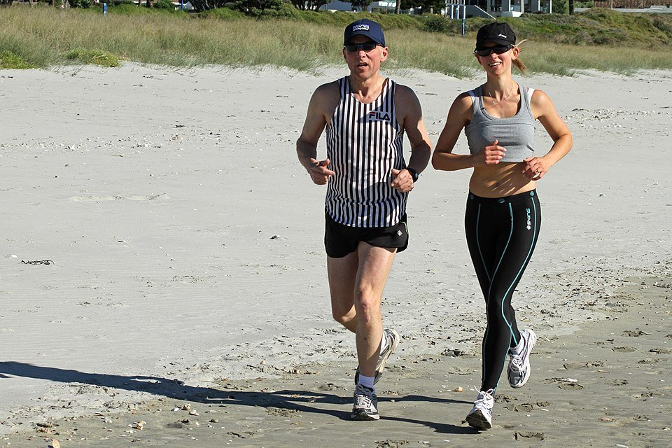 couple jogging on a beach